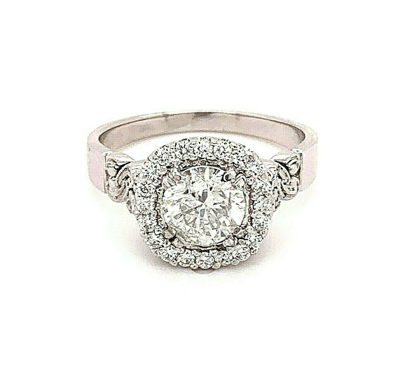Round Diamond Halo Engagement Ring 1.50 tcw in 18kt White Gold