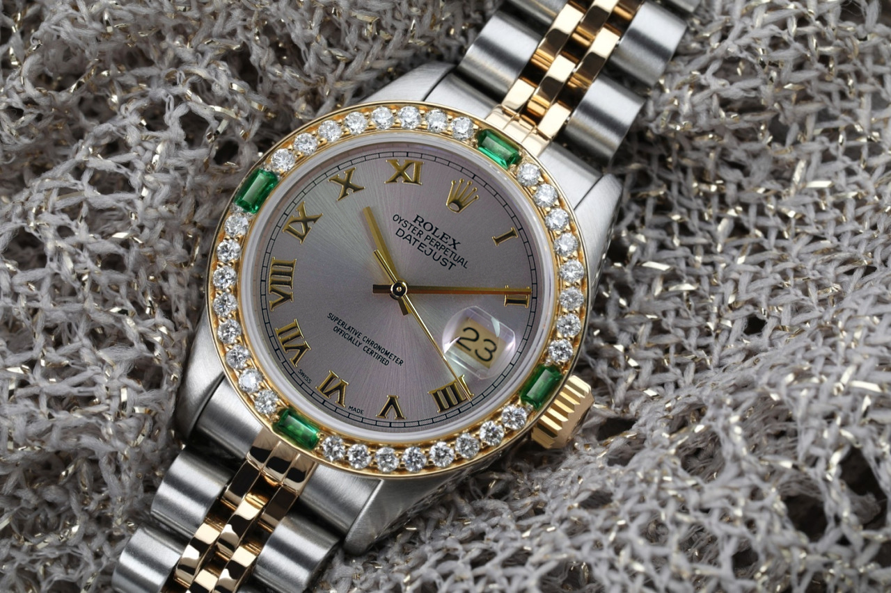 Lady Rolex 26mm Dark Grey Roman Numeral Dial Diamond + Emerald Bezel Two Tone Watch