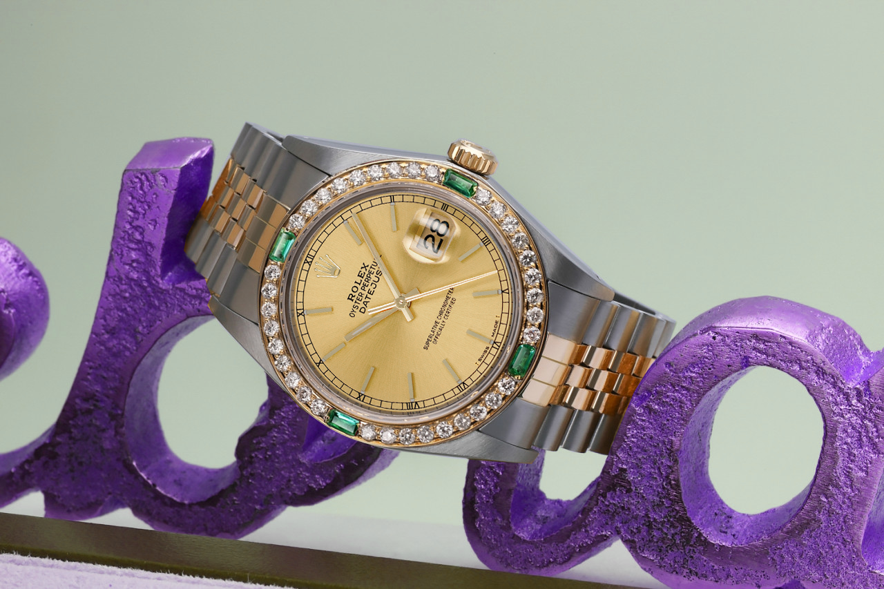 Rolex 36mm Datejust Diamond/Emerald Bezel Champagne Stick Dial Two