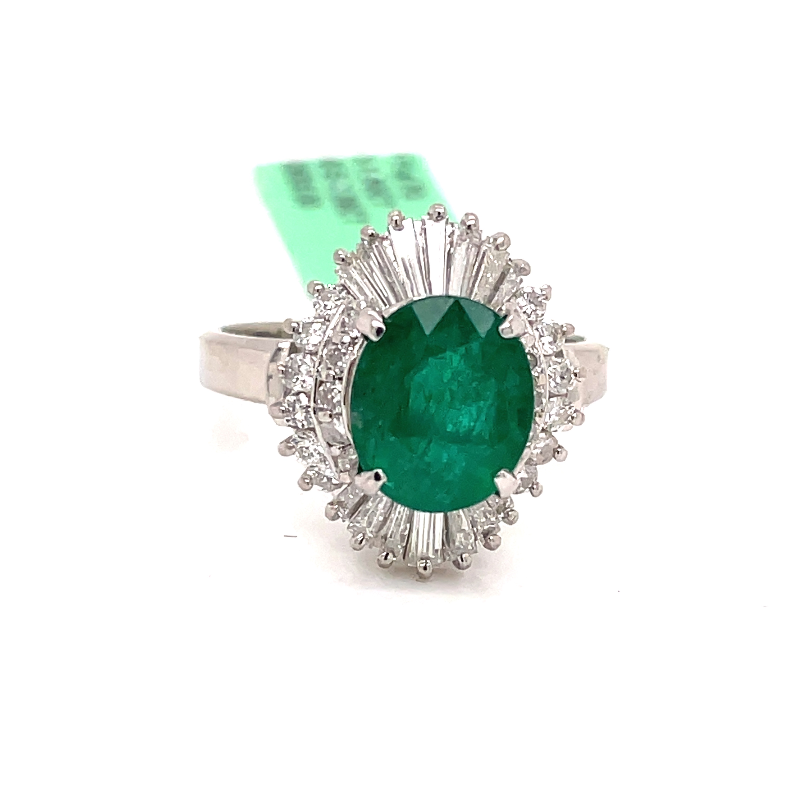 Oval Emerald and Baguette/ Round Diamonds Ring in Platinum
